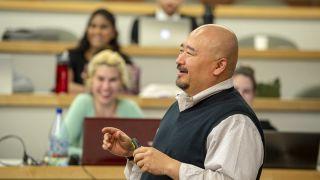 A professor addresses a classroom